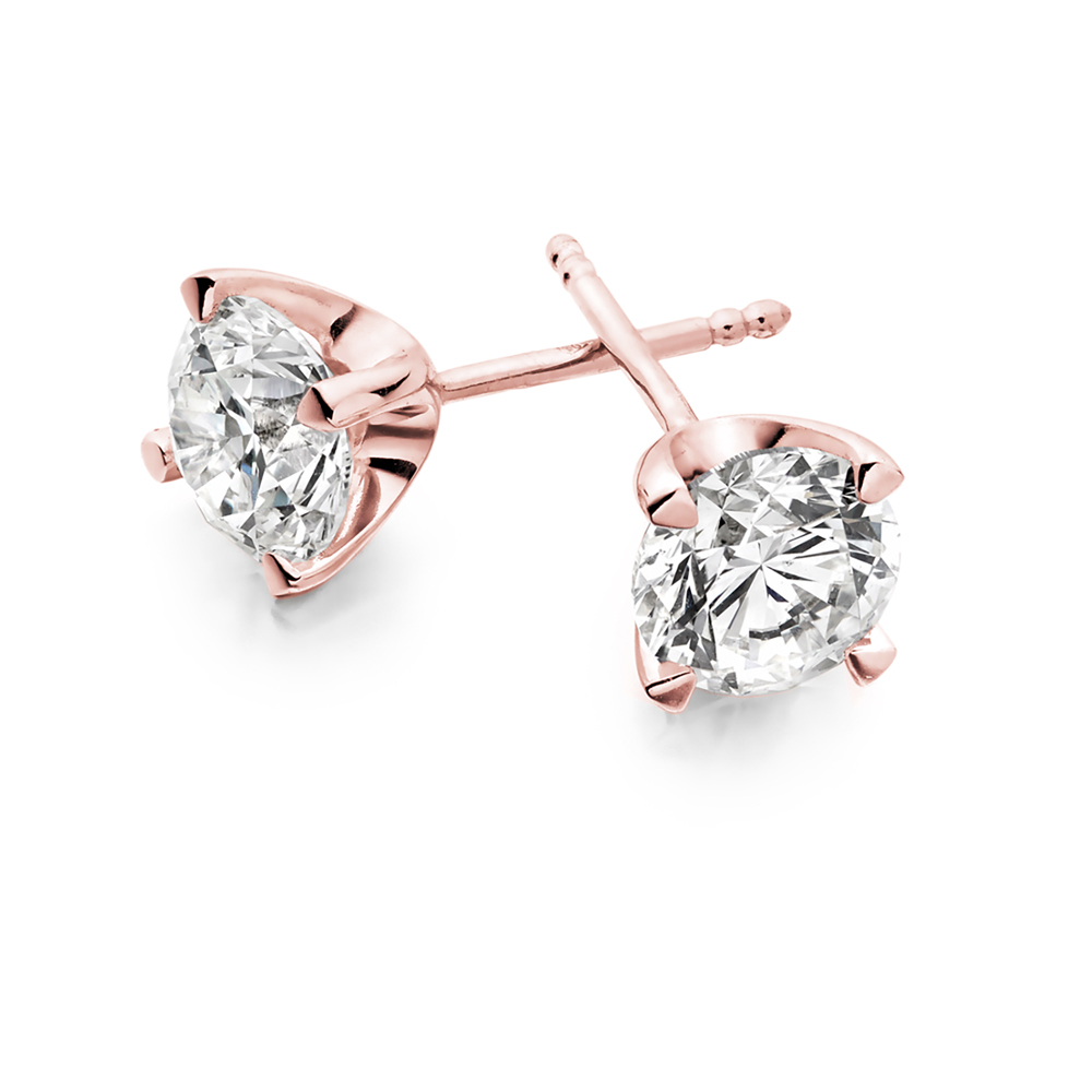 Orecchini punto luce in oro rosa 18 kt modello griffe classica ct. 0.60